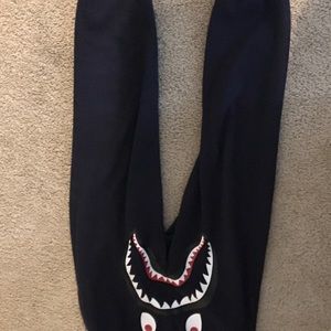 Size small Bape sweatpants and plastic supreme bag